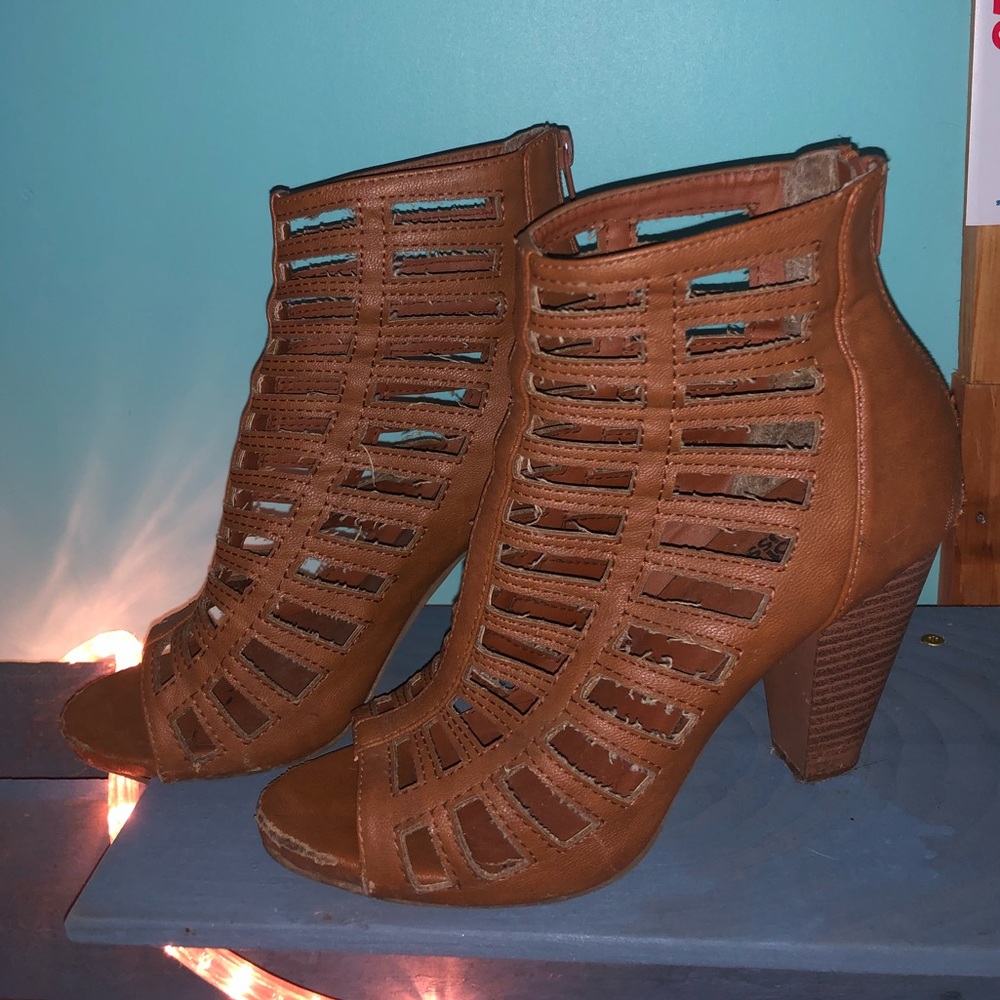 Women’s heeled cage sandals. Good condition.